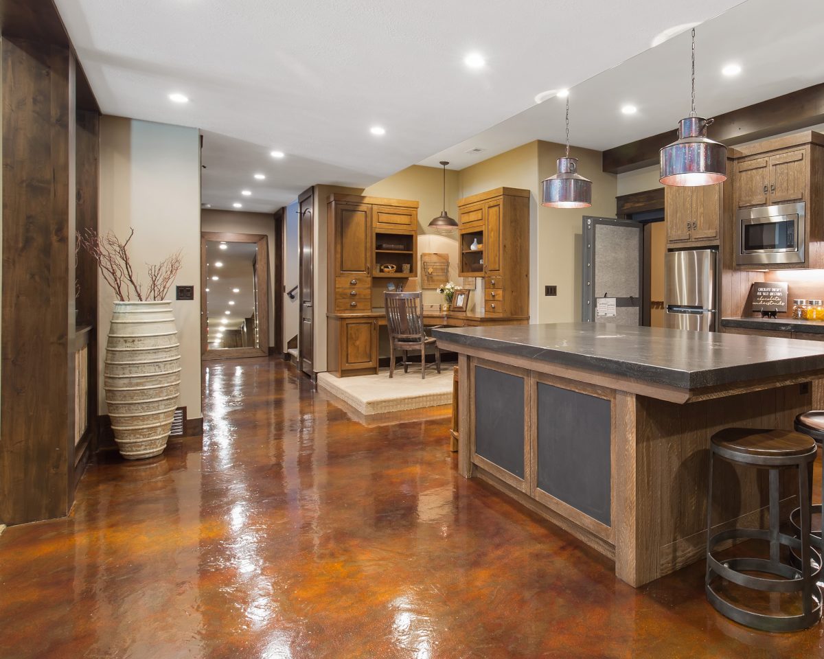 a basement kitchen & nook with colorful epoxy flooring